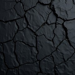 Black rock texture. Rough mountain surface with cracks. Close-up. Stone background with space for design.
