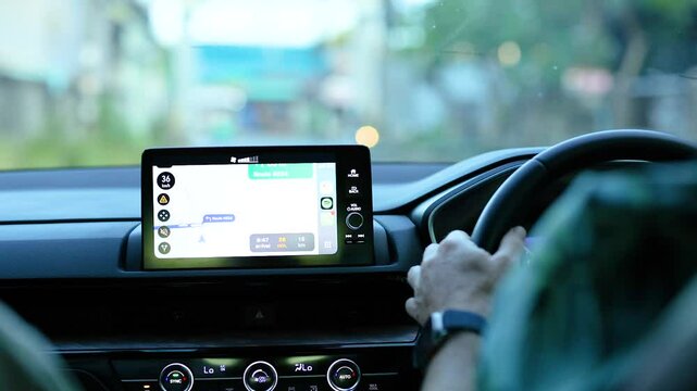 Driver Interacting with Carplay Navigation in Phuket