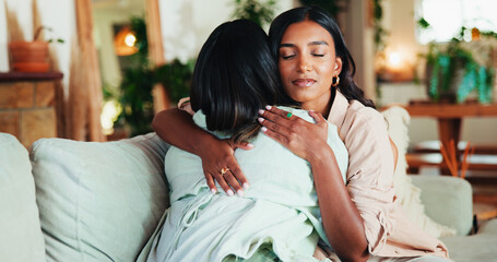 Women, friends and hug with support for comfort, love or trust with solidarity in living room. People, bonding and embrace for welcome, communication and care in home lounge for reunion and empathy