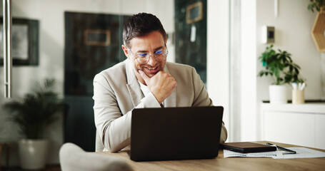 Laptop, remote work and smile with man in home office for investment or portfolio management....