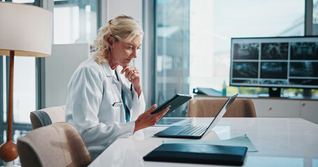 Doctor, healthcare and technology with woman at office desk in hospital for diagnosis, planning or...