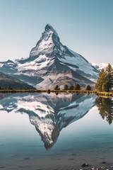 Naklejka premium Stunning mirror reflection of Matterhorn in serene alpine lake captured from low altitude by drone
