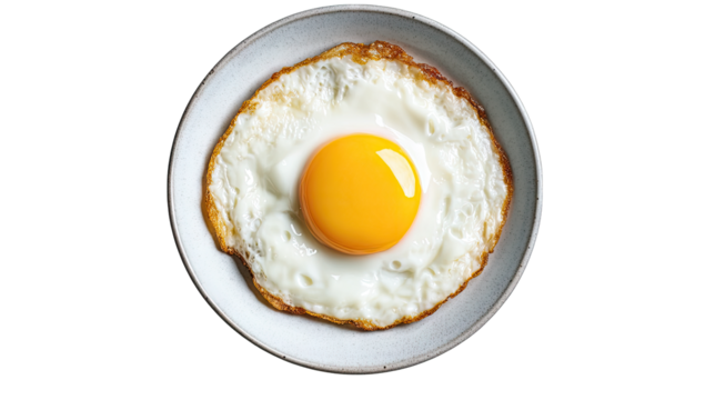 a perfectly cooked fried egg sits on a simple gray plate showcas