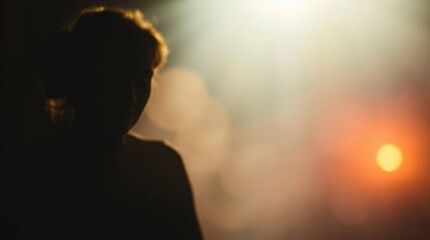 Silhouette of a Young Woman in Dim Light with a Mysterious Atmosphere and Bokeh Background, Featuring Soft Shadows and Ambient Glows