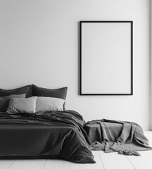 Monochrome bedroom interior with large empty frame above bed.