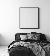 Monochrome bedroom with empty square frame above bed.