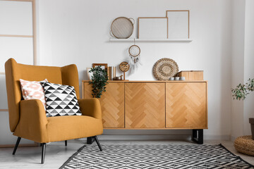 Interior of living room with armchair and commode