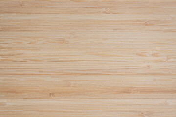 Texture smooth bamboo board. Surface of a well-polished bamboo board composed of planks of same tone, pattern, background, close-up, high resolution.