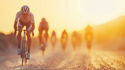 Fototapeta premium A group of cyclists races along a dusty path as the sun sets in the background, creating a beautiful and dynamic atmosphere