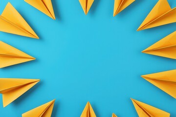 Yellow Paper Airplanes Arranged in a Circular Pattern on Vibrant Blue Background