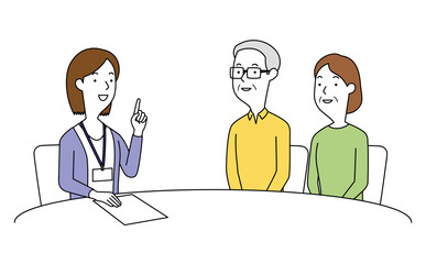 女性の相談員にアドバイスを聞く高齢の男女