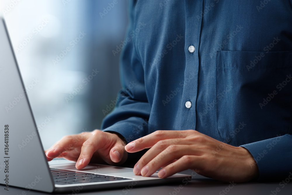 Poster Hands typing on laptop computer keyboard. Businessman working at desk in office. Using technologies in business.