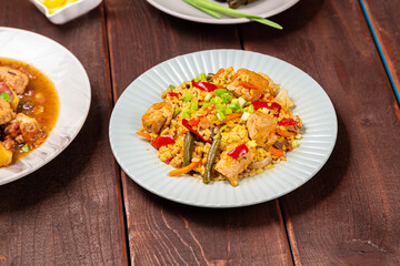 Menorah lighted candles in candlesticks with Star of David at set table bulgur