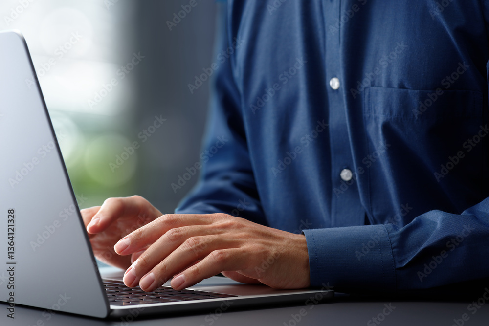 Aufkleber Hands typing on laptop computer keyboard. Businessman working at desk in office. Using technologies in business.