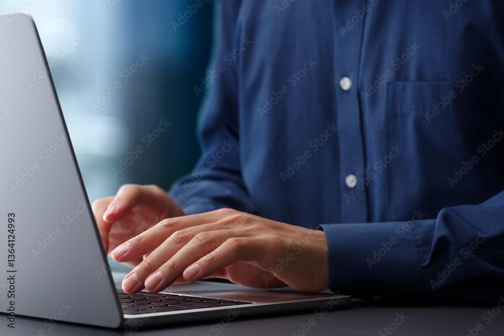 Aufkleber Hands typing on laptop computer keyboard. Businessman working at desk in office. Using technologies in business.