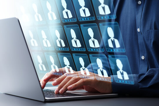 Customer data management and employee data management. CRM customer relationship management. Businessman using laptop computer to manage data.