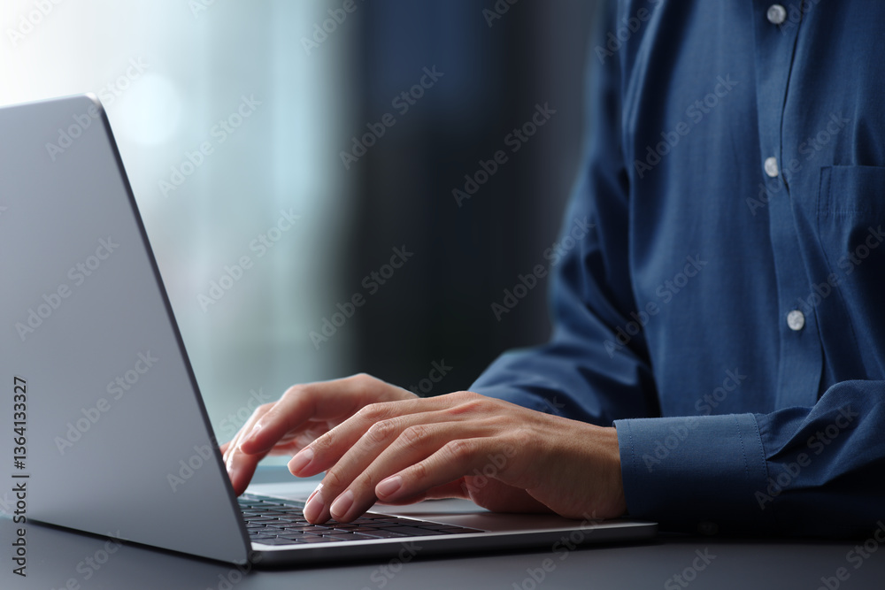 Aufkleber Hands typing on laptop computer keyboard. Businessman working at desk in office. Using technologies in business.