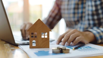 Fototapeta premium Real estate investor analyzing property market trends on a laptop. minimalist,