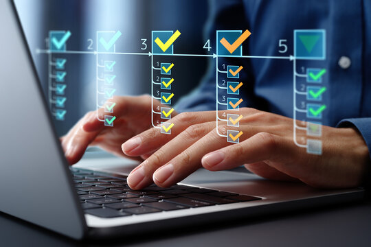 Task management and prioritization systems. Project management and performance tracking systems. Businessman using laptop computer to manage and prioritize tasks.