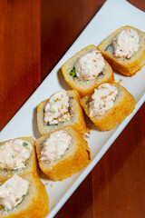 Close-Up of Tempura Shrimp Sushi with Chipotle Sauce