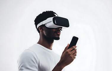 A man wearing VR goggles, holding his phone as if controlling the experience on a white backdrop 