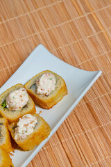 Close-Up of Tempura Shrimp Sushi with Chipotle Sauce