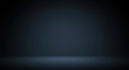 Obraz premium A minimalistic dark blue studio backdrop with soft lighting creating a sense of depth and space
