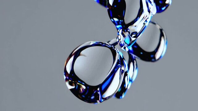 Close-up of shiny abstract liquid droplet sculpture in blue and chrome tones on neutral background. Concept of futuristic materiality
