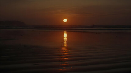 Fototapeta premium Golden Sunset Reflection on Wet Sand Beach Coastal Scene with Island Silhouette and Warm Orange Sky