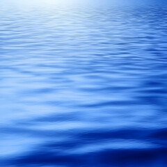 Calm blue water surface, gentle ripples, serene lake background, ideal for relaxation or travel websites