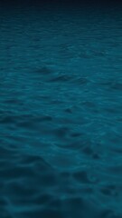 Obraz premium Blue green water surface. Night. Small waves. Ripples. Reflection of light. Dark teal water background with space for design.
