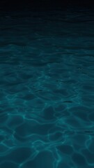 Obraz premium Blue green water surface. Night. Small waves. Ripples. Reflection of light. Dark teal water background with space for design.