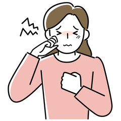 目のかゆみに悩む女性の上半身