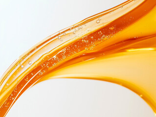 A dynamic splash of amber-colored fluid.