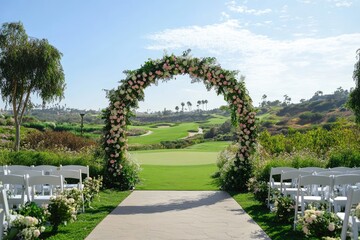 Outdoor wedding ceremony arch, lush floral arrangements, scenic golf course backdrop