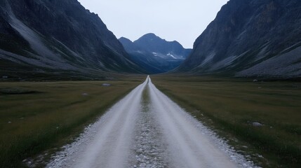 Fototapeta premium Mountain road leading into a valley