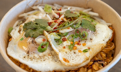 Bowl of Thai Noodle Food with Egg on Top