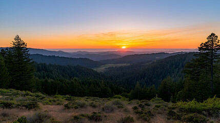 Panoramic View Of A Mountain Valley Forest With A Glowing Orange Sunset Sky Above The Horizon