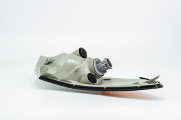 Automotive Turn Signal Light with Clear and Amber Lens Isolated on off-White ground. Industrial car Light Design reference