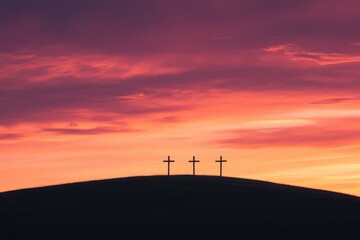 Obraz premium Three crosses on hill with sunset sky, Easter resurrection background, holy week concept, copy space for text, lent season, religious holiday