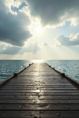 Fototapeta premium Tranquil Wooden Pier Extending Towards a Serene Ocean Under a Cloudy Sky