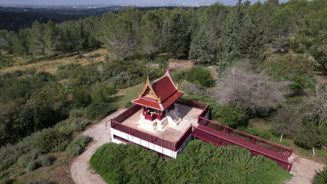 Aerial pullback view from Ben Shemen Forest reveal Traditional Thai Pavilion