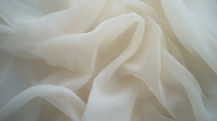the delicate folds of a light and airy, transparent fabric