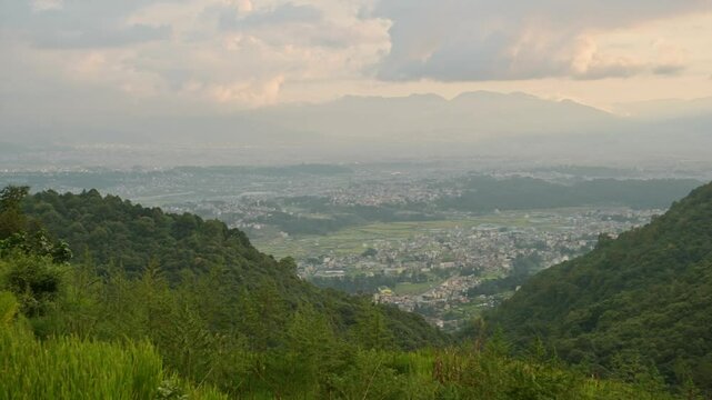 Pady Fields and Kathmandu City Sunset, Rural Landscape Scenery in Nepal with Rice Fields Paddies and Paddy Fields Terraces in a Rural Village in Kathmandu Valley with the City Behind