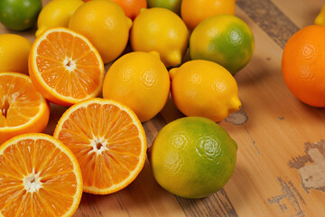 Fresh citrus fruits in vibrant colors on a wooden surface  