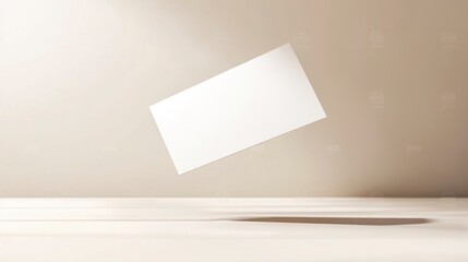 Blank business card mockup.  A blank white card floats in mid-air against a beige backdrop