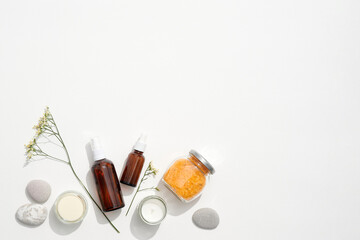 Amber bottles, soft candlelight, and smooth stones create a minimalist spa concept, minimalist design strengthening branding, minimalist skincare layout enhancing visual appeal