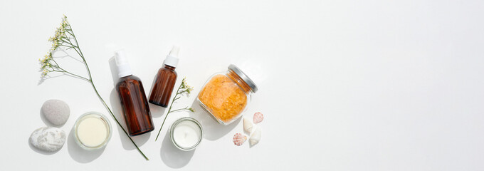 Brown bottles, herbal bath salts, and natural candles showcase organic skincare, organic beauty concept reinforcing sustainability, organic approach appealing to eco-conscious buyers