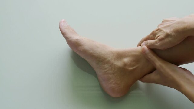 Woman massage ankle pain foot woman, sprain feet heel knee sore people chronic joint leg hurt injury bone arthritis skeleton girl accident fitness sport exercise medical care