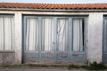 old wooden ancient door with windows shop house building facade vacant store closed after bankruptcy